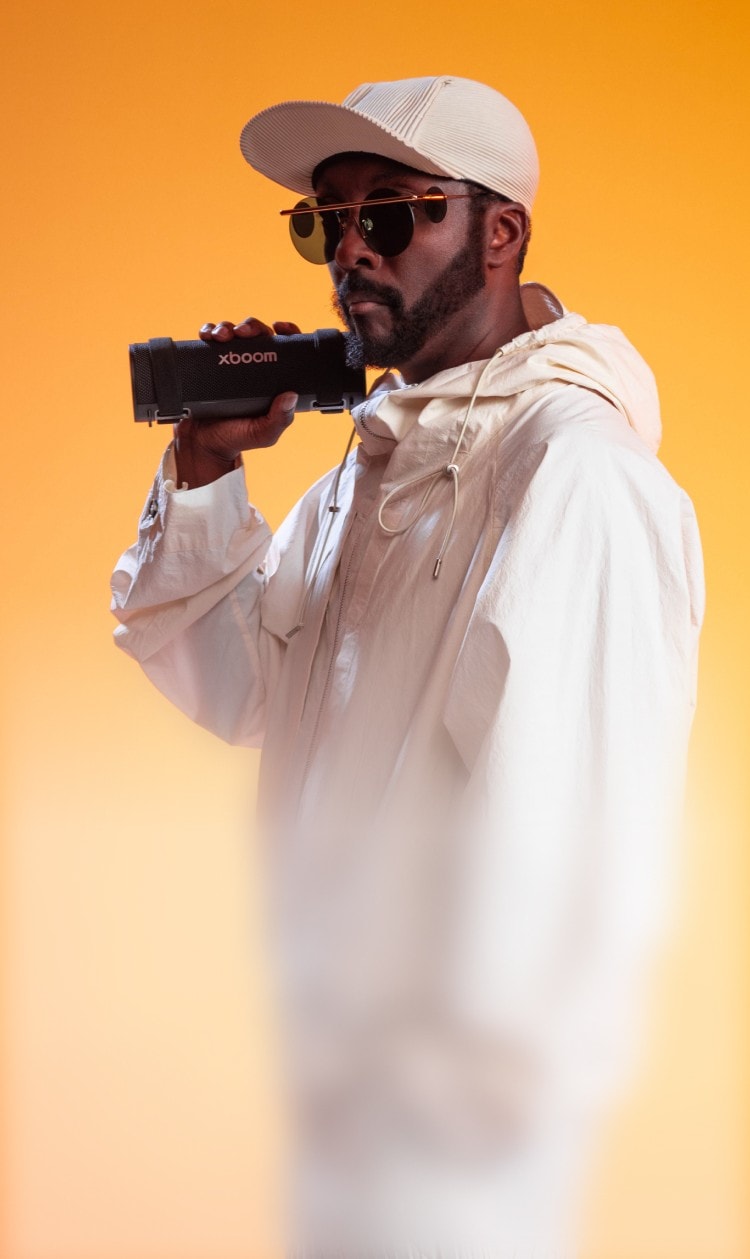 Will.i.am holiding an xboom speaker